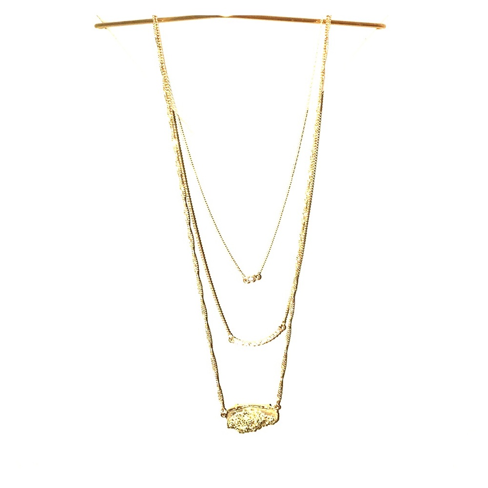 3 layered gold necklace.